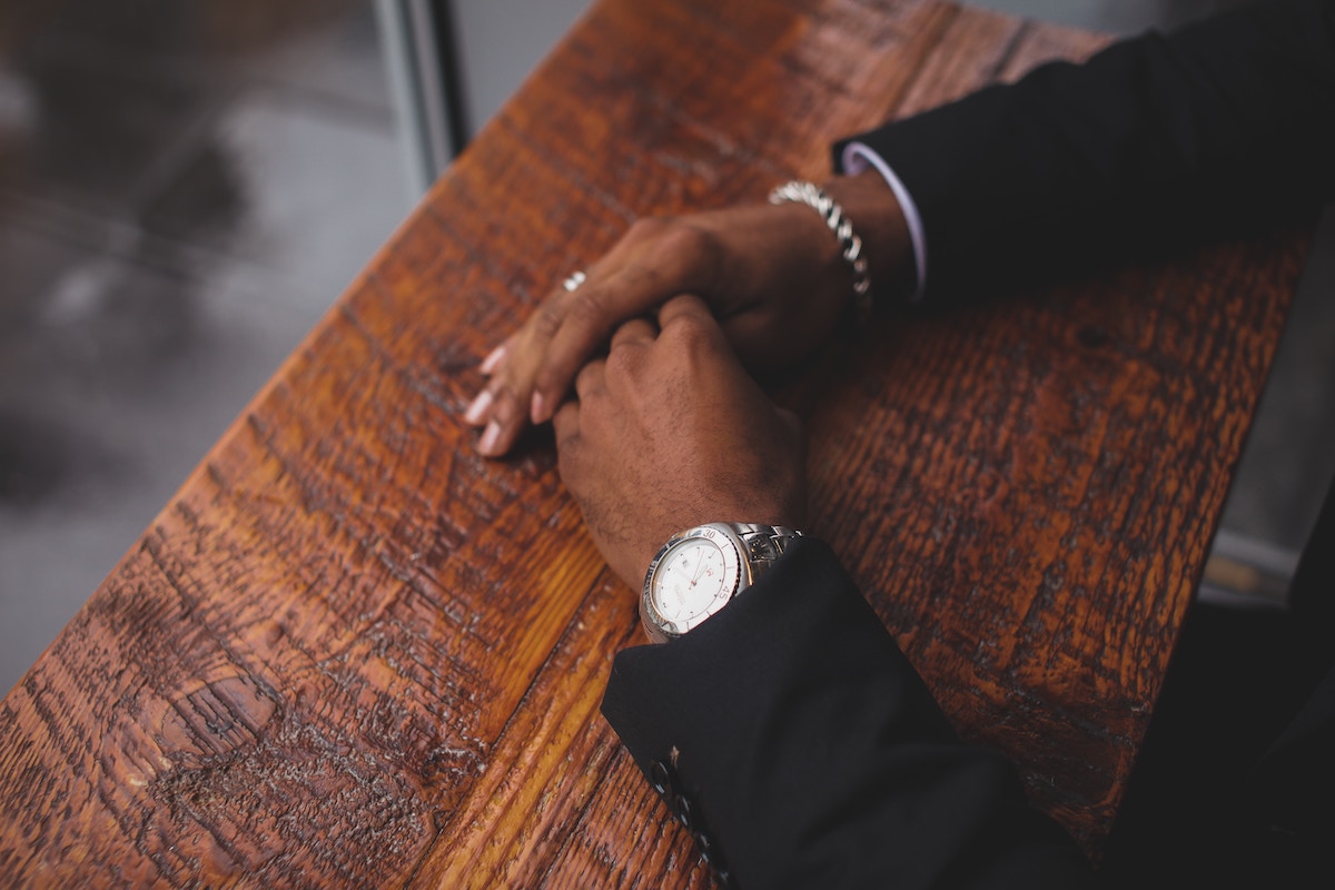 5 Crucial Hiring Tips for the New Year, hiring manager with hands on desk